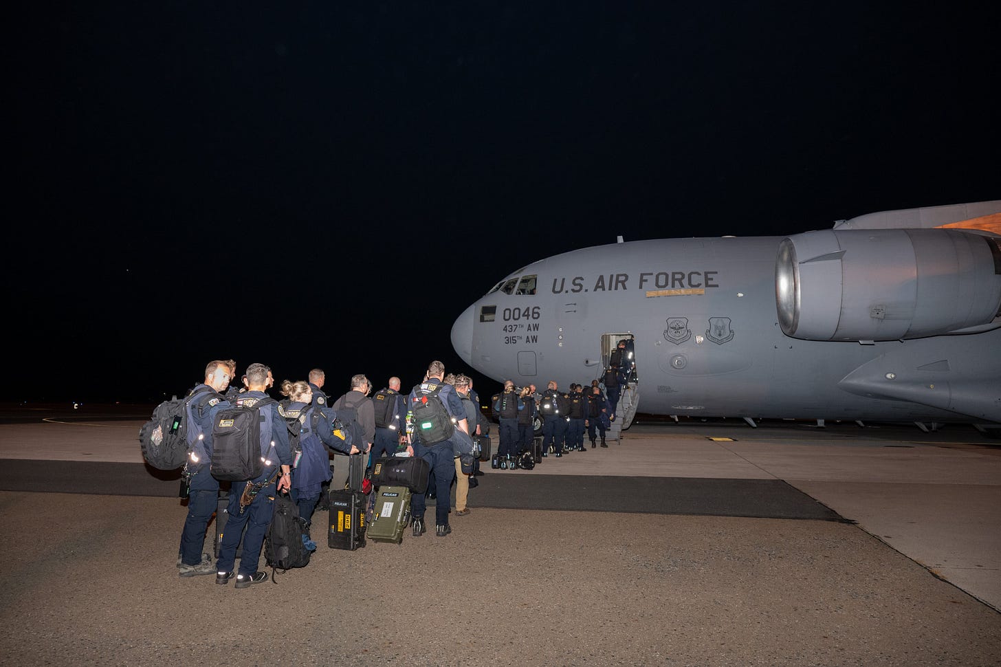 Urban Search & Rescue (USAR) team members board a USAF C-17 in Delaware  bound for Venezuela (US Southern Command photo)