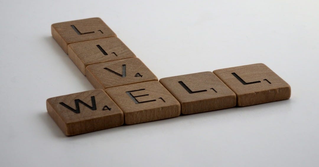 brown wooden letter blocks on white surface