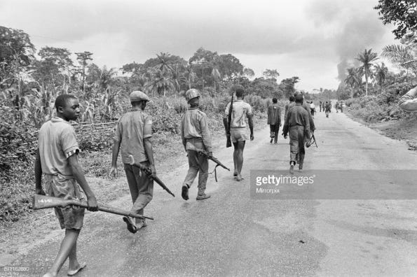 Biafran soldiers seen here advancing towards the Nigerian army, 11th June 1968 .
(Photo by Ron Burton/Mirrorpix/Getty Images)
Biafran soldiers seen here advancing towards the Nigerian army, 11th June 1968 .
(Photo by Ron Burton/Mirrorpix/Getty Images)