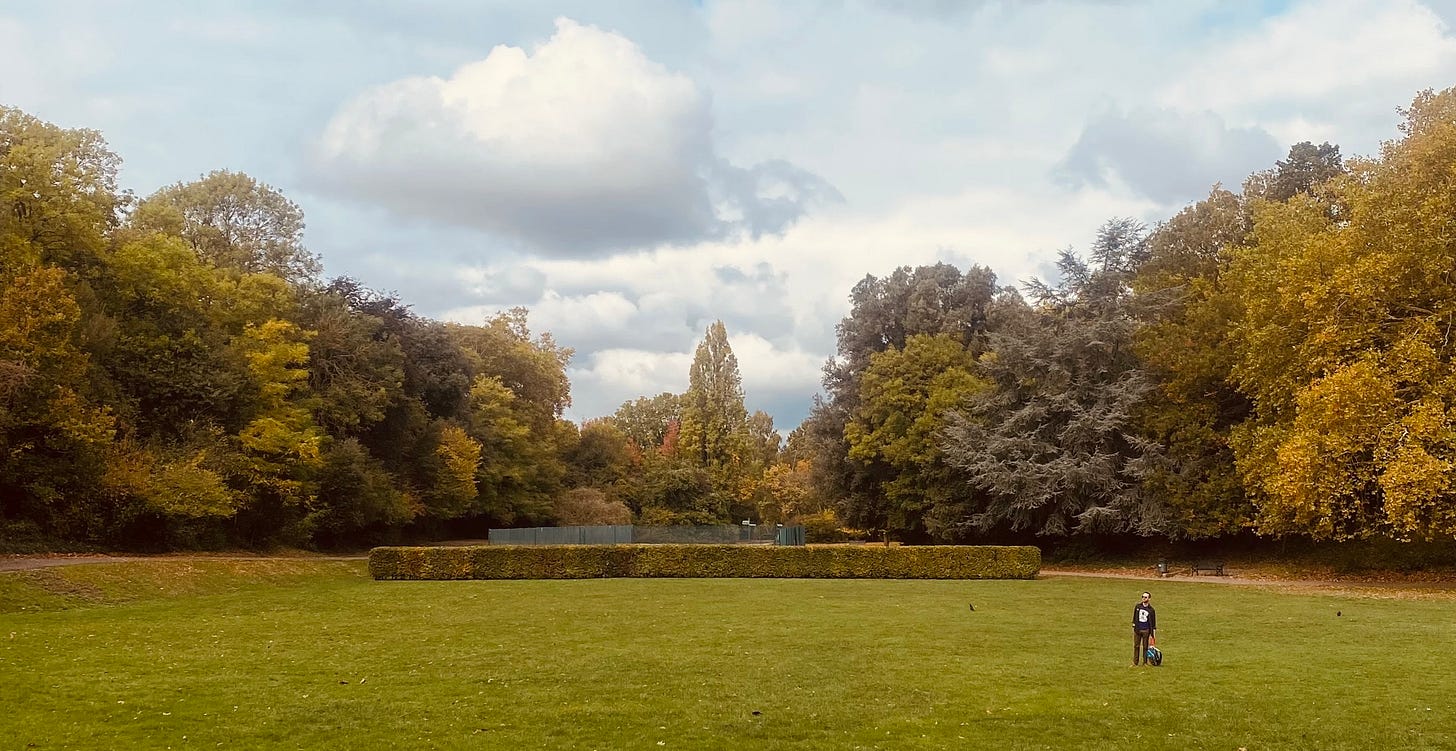 A photograph of the author standing at a distance in Maryon Park, London