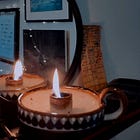 press a fresh candle into the spent one’s quivering flame