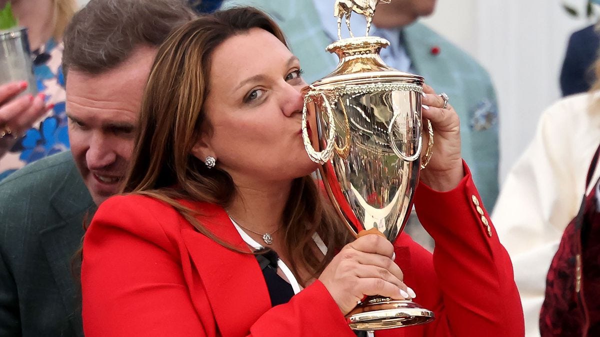 Cherie DeVaux, trainer of Golden Tempo, celebrates with the trophy in the winner's circle following the 152nd running of the Kentucky Derby on May 2.