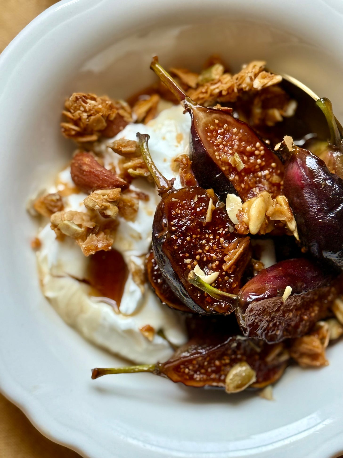 Maple Carmelized Figs in a bowl with yogurt and granola. Studio Delicious.com 