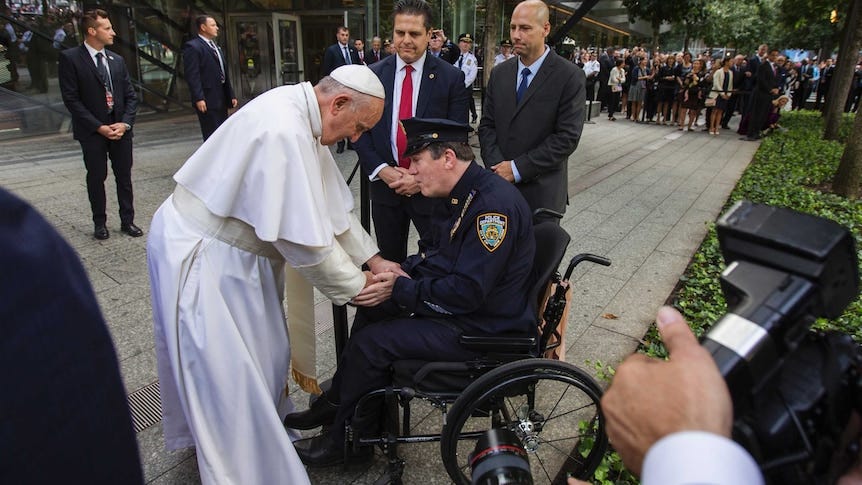 Pope Francis shakes the hand of a New York Police Department officer while visiting the 9/11 Memorial in New York. Pope Francis shakes the hand of a New York Police Department officer while visiting the 9/11 Memorial in New York.