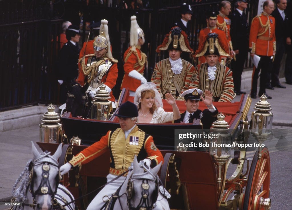 British Royalty. London, England. July 1986. Wedding of Prince Andrew. Prince Andrew together with his bride Sarah Ferguson wave from the carriage at it departs Westminster Abbey.