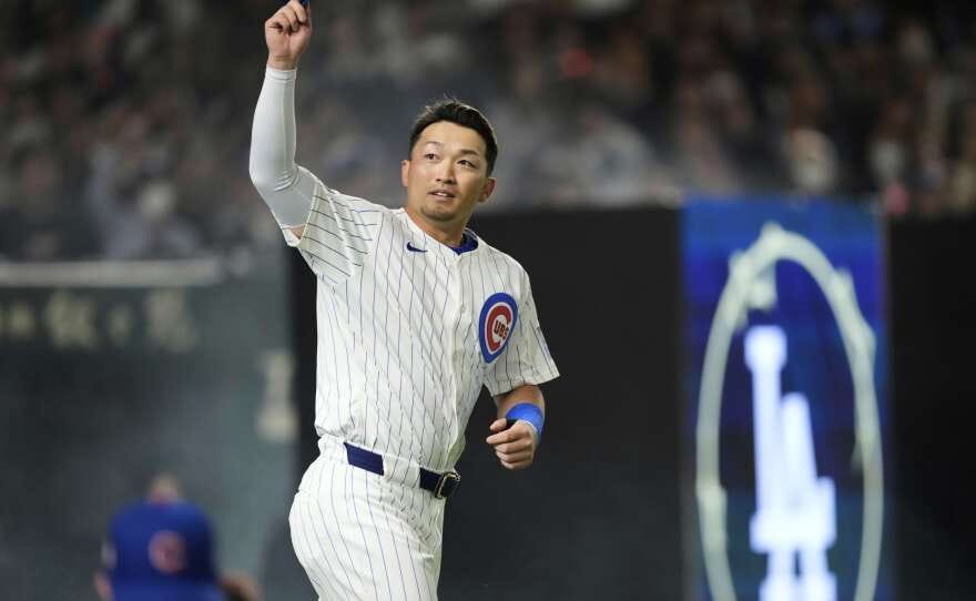 Chicago Cubs' Seiya Suzuki waves to fans during warmups before an MLB Japan Series baseball game against the Los Angeles Dodgers in Tokyo, Japan, Tuesday, March 18, 2025. (AP Photo/Hiro Komae)