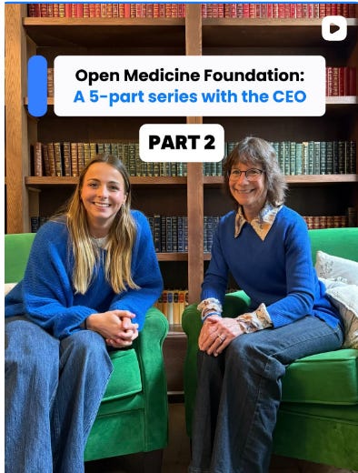Image is a screenshot of a video from social media. In the shot, we can see Jemma Bella and Linda Tannenbaum (Founder of OMF) sitting in a library on bright green chairs. They are both wearing blue. The caption at the top says "Open Medicine Foundation: A 5-part series with the CEO. Part 2" Image is a screenshot of a video from social media. In the shot, we can see Jemma Bella and Linda Tannenbaum (Founder of OMF) sitting in a library on bright green chairs. They are both wearing blue. The caption at the top says "Open Medicine Foundation: A 5-part series with the CEO. Part 2"
