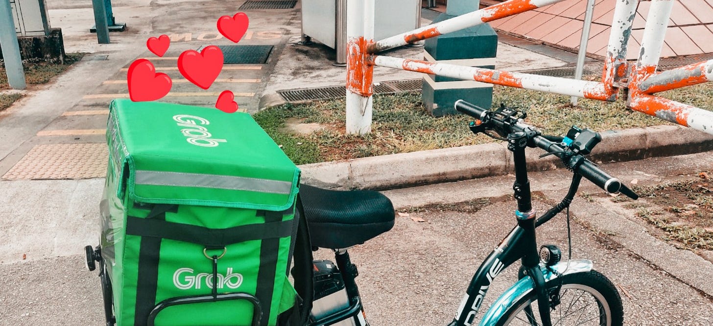 Electric scooter with the Grab food bag in the carrier