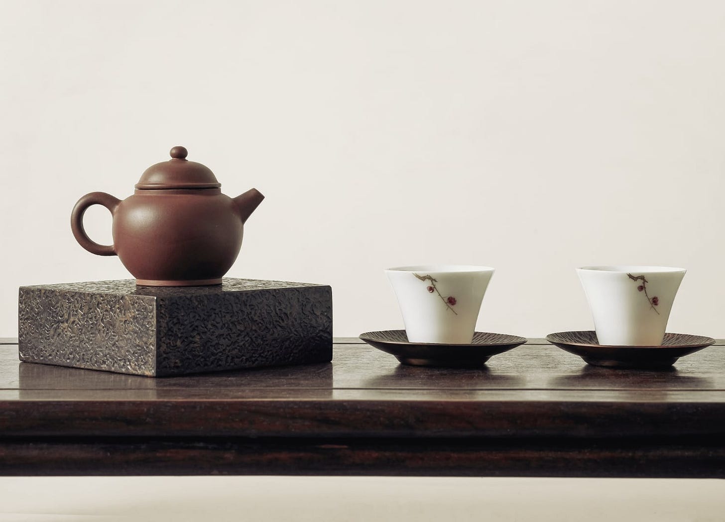 Teapot and two teacups