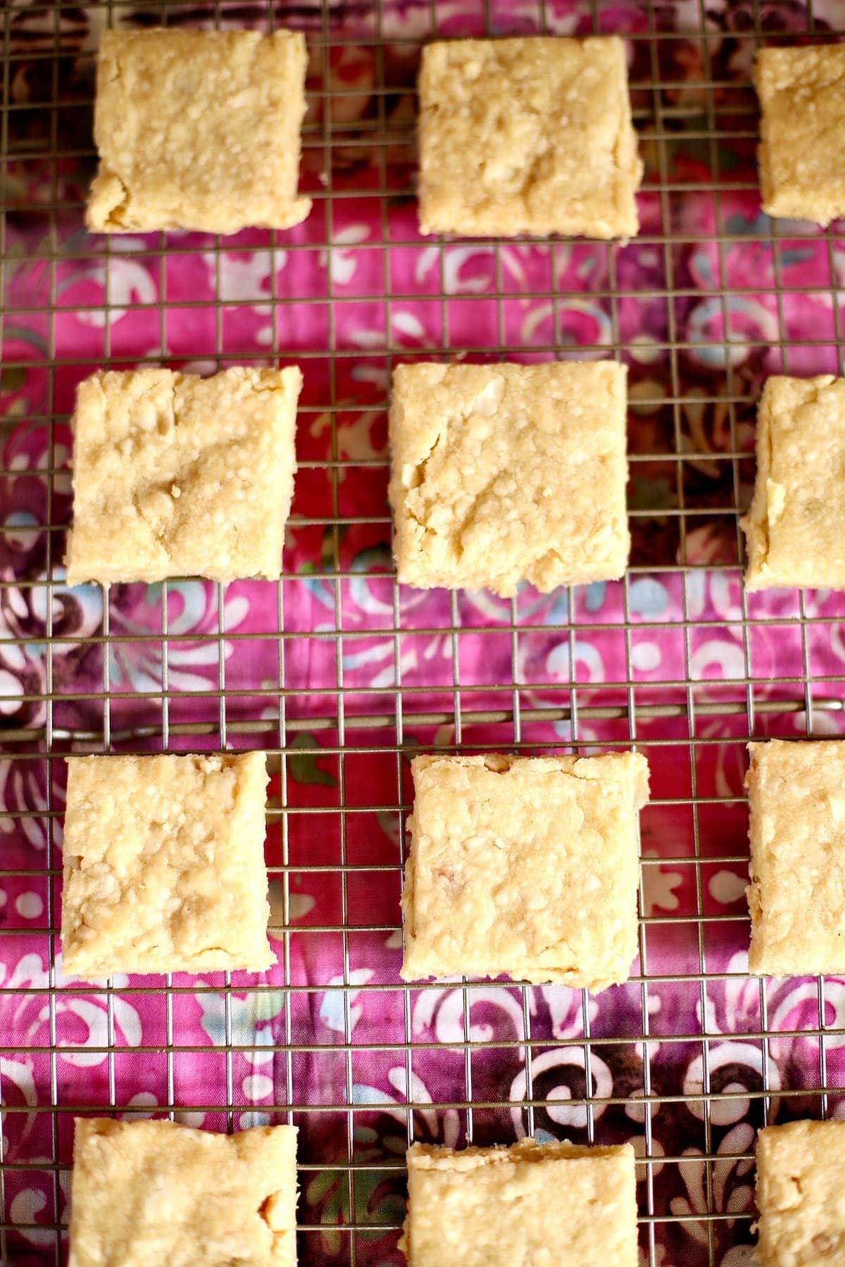 a tray of shortbread cookies on a wire rack. a tray of shortbread cookies on a wire rack.