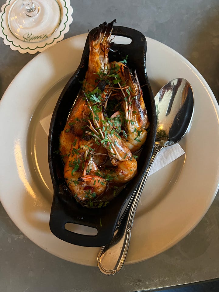 hot honey shrimp in a cast iron pan from slim's pizzeria