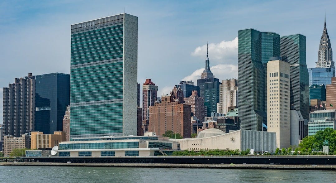 city buildings near body of water during daytime