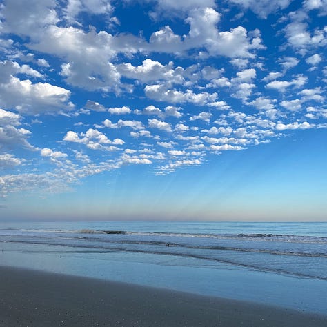 three views of ocean, sky and clouds at different times of day