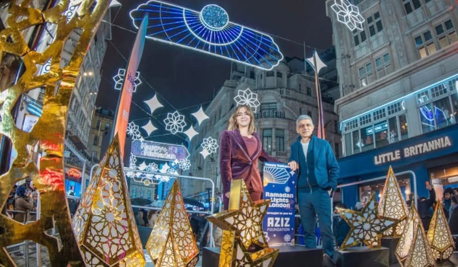 May be an image of one or more people and text that says "Αή ဠကှီ ทวี่ 出 И 1IHI 1II IIK LITTLE BRITANNIA Ramadan Lighto London ea -R 一· AZIZ FOUNDATION OUND" May be an image of one or more people and text that says "Αή ဠကှီ ทวี่ 出 И 1IHI 1II IIK LITTLE BRITANNIA Ramadan Lighto London ea -R 一· AZIZ FOUNDATION OUND"