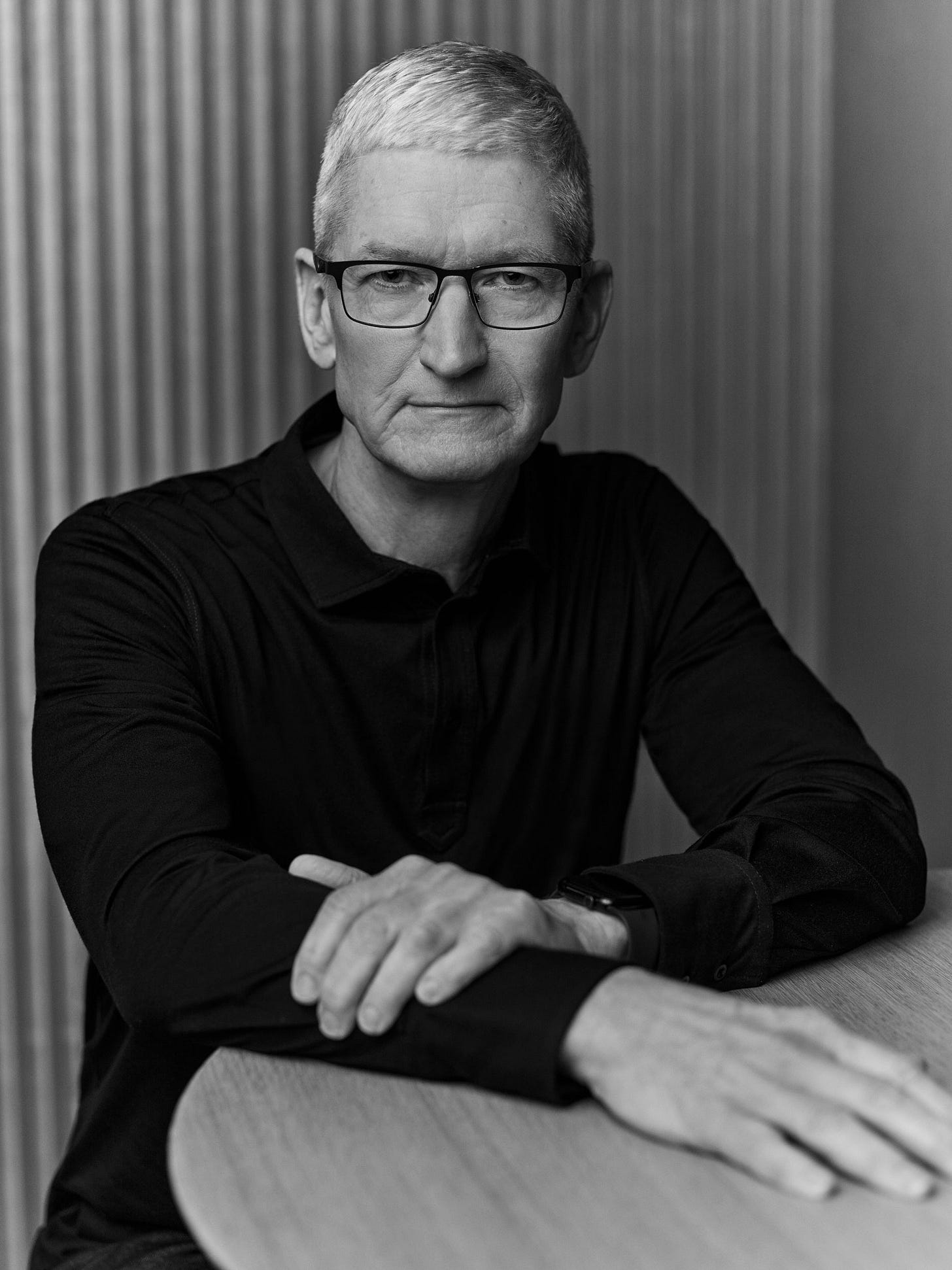 Image may contain Tim Cook Body Part Finger Hand Person Face Head Photography Portrait Adult and Accessories