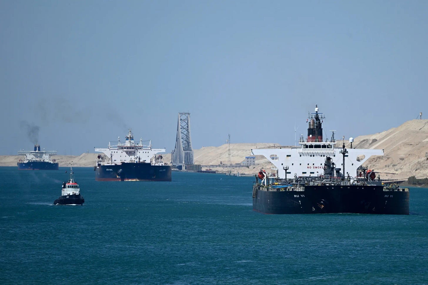 Ships sail along the Suez Canal near Ismailia, on April 16.