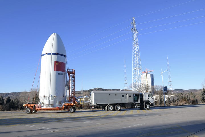 The fairing for the Long March 6A Y15 vehicle being transported to and lifted onto the launch pad.