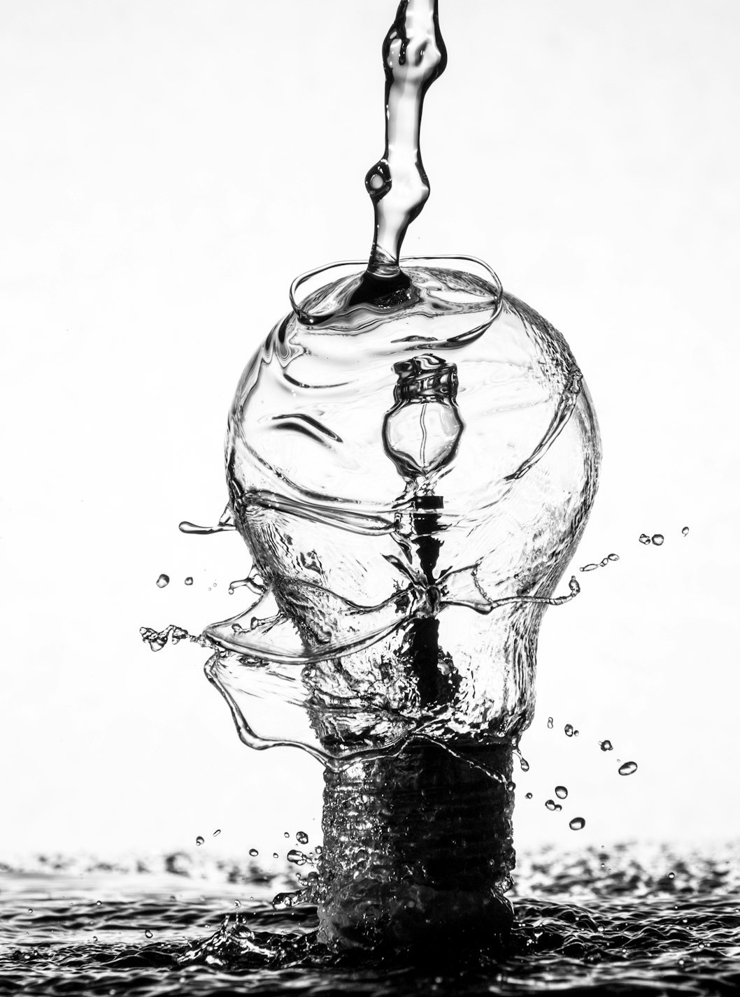 water dropping on light bulb water dropping on light bulb