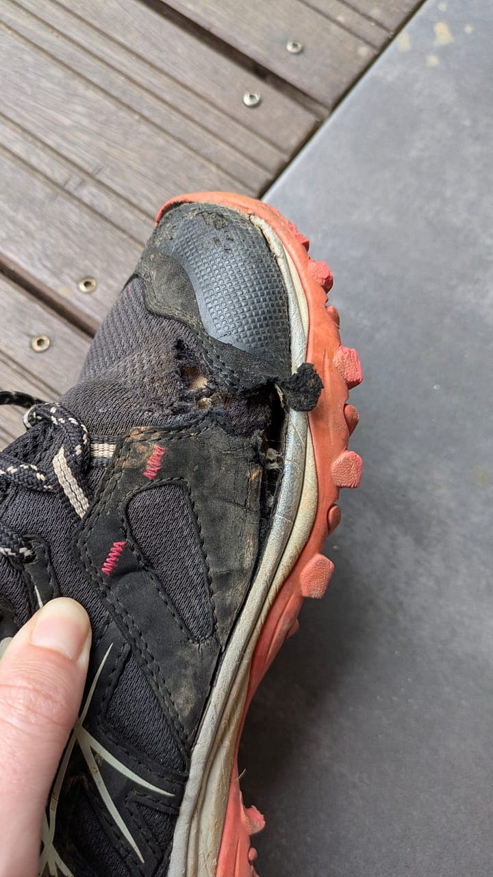 This is a picture of my very broken but not yet completely gone hiking shoe; to the right is a photo of me in the pouring rain having reached the space station.