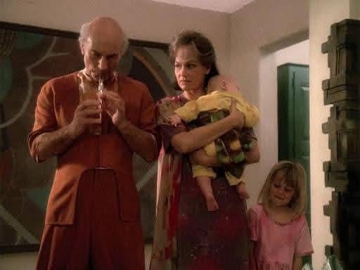 r/scifi - person and tv character holding a baby.