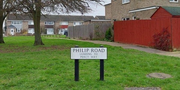 Philip Road leading to Percy Way road sign next to green space in a residential area in Witham
