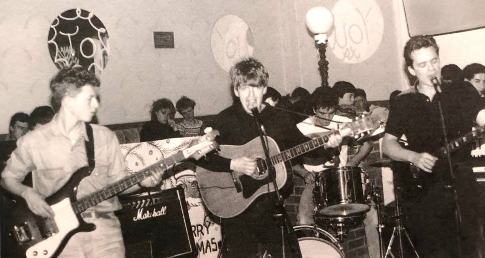 Black and white photo of the Las playing in a pub.