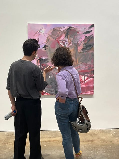 images of artists standing next to their artworks