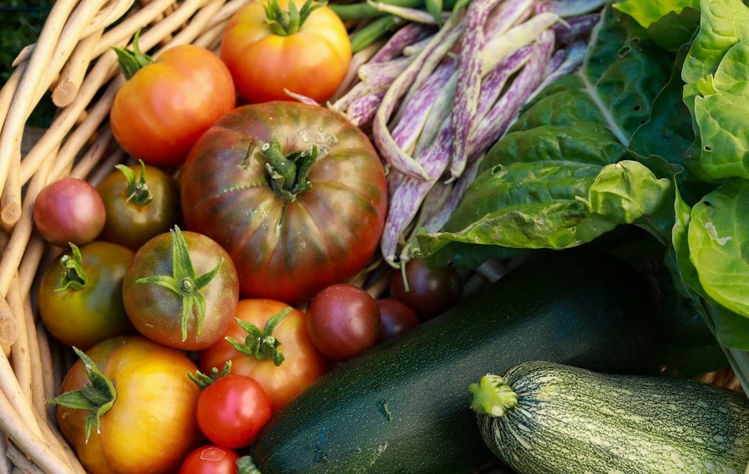 orange and green vegetables on brown woven basket