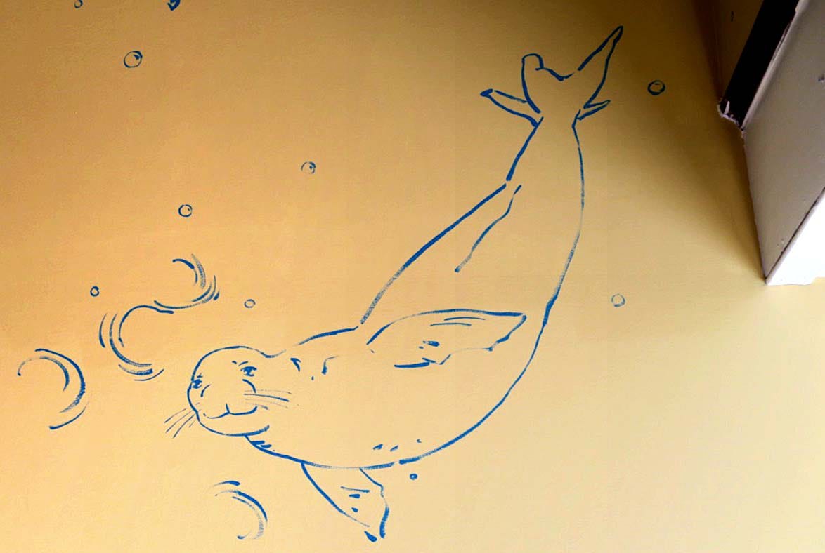 A drawing of a seal

Description automatically generated