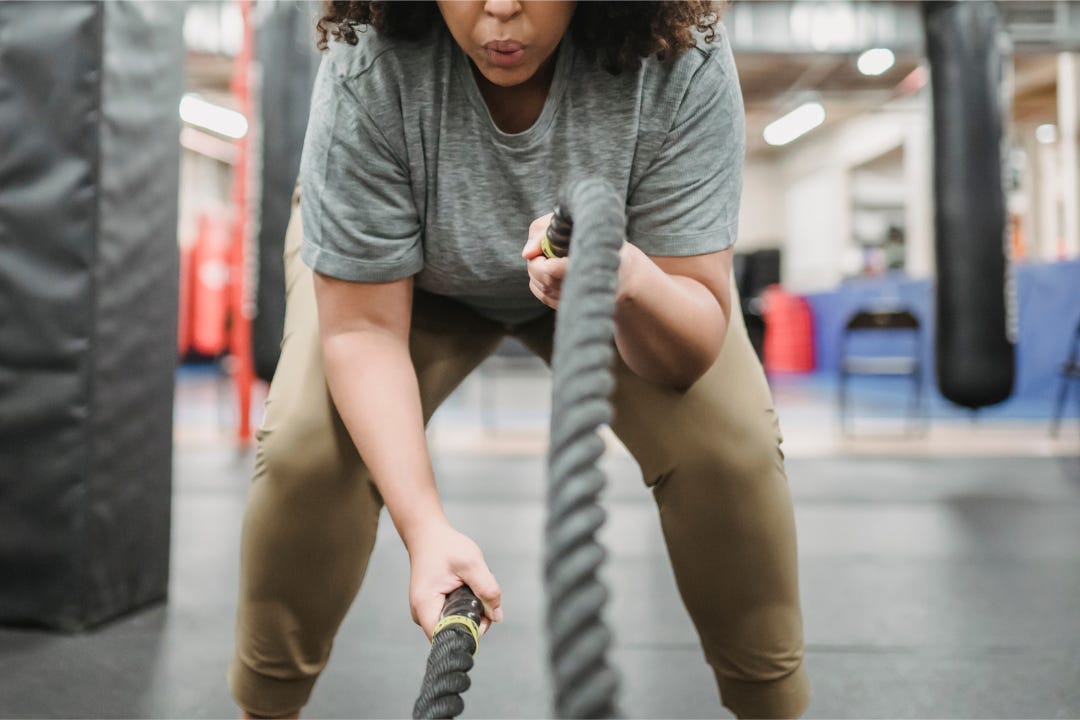 woman strength training at the gym