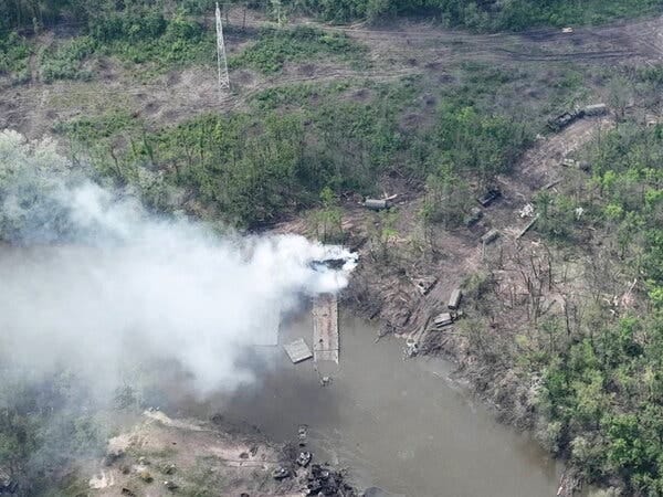 An aerial photograph shared by the Ukrainian Airborne Forces showed smoke rising above a bridge across the Seversky Donets River in eastern Ukraine. An aerial photograph shared by the Ukrainian Airborne Forces showed smoke rising above a bridge across the Seversky Donets River in eastern Ukraine.