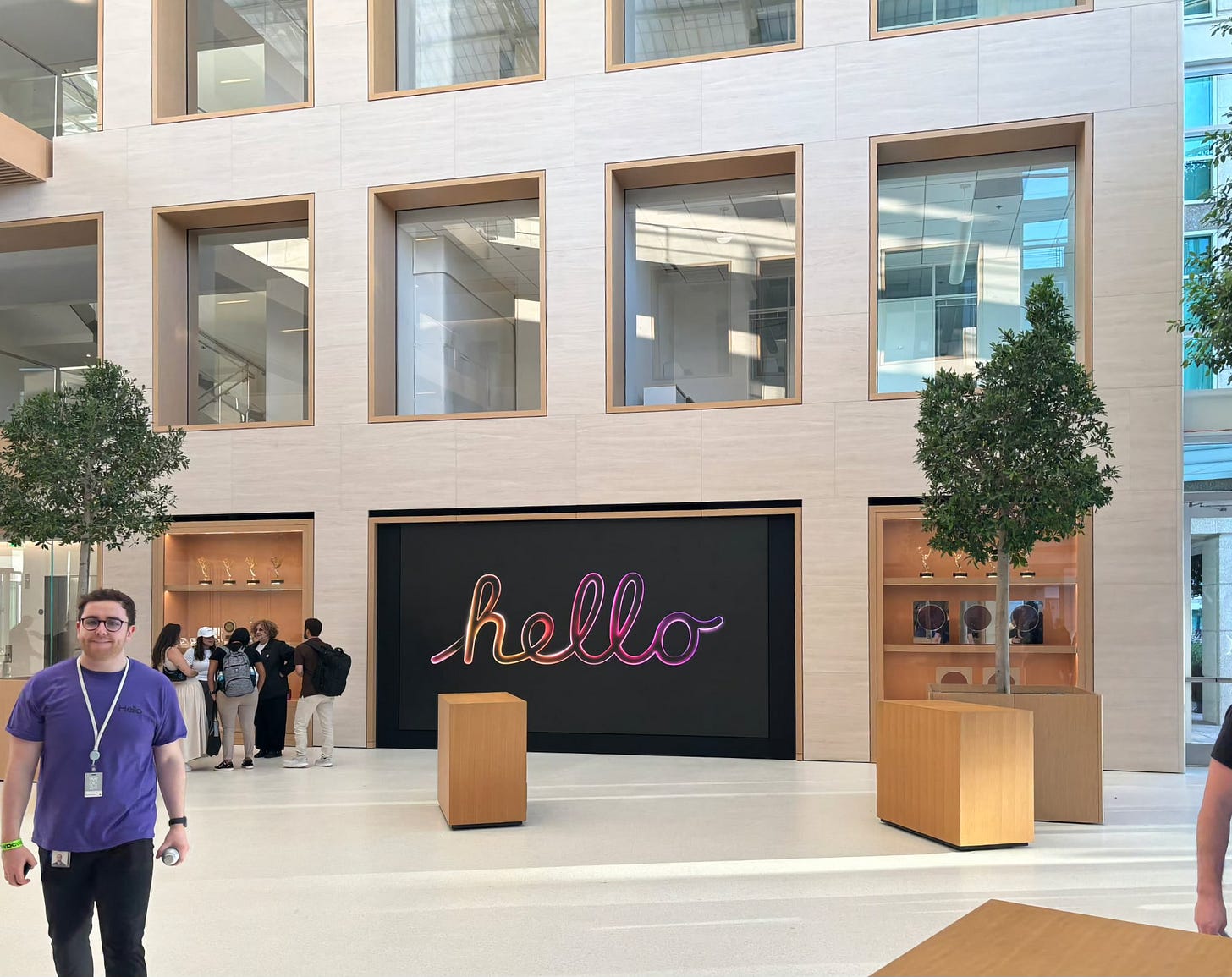 The interior of Apple Infinite Loop. Pictured is a video wall and mirrored trophy cases. The interior of Apple Infinite Loop. Pictured is a video wall and mirrored trophy cases.