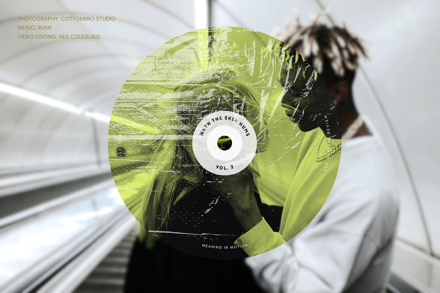 Cover image featuring a textured compact disc graphic tinted lime green with the text "When the Skin Hums, Vol. 2." The disc overlays a desaturated photograph of a young man and a woman looking intimately at each other. In the upper-left corner, the metadata text reads: "PHOTOGRAPHY: cottonbro studio, MUSIC: RUIIN, VIDEO EDITING: Neil Czeszejko." Part of the Overtones series at The Subtext Review.