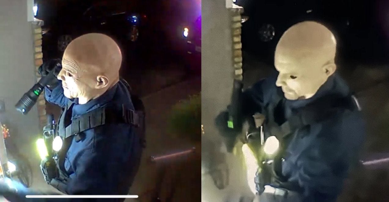Two side-by-side surveillance images show a person wearing a bald, pale-colored mask with exaggerated facial features, dressed in dark tactical-style clothing and carrying a flashlight. The individual appears to be impersonating law enforcement, as they wear gear resembling a police or security vest with a visible flashlight and possibly other equipment. The scene takes place at night on a front porch, with flashing lights from a police vehicle visible in the background.
