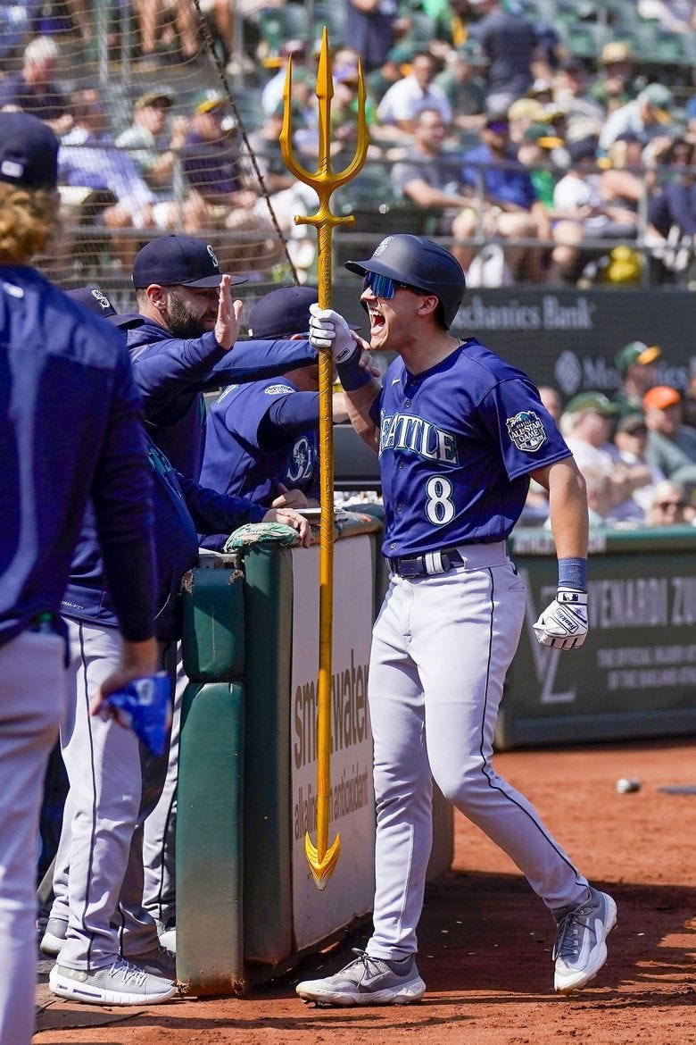 Mariners outfielder Dominic Canzone celebrates after hitting a two-run home run against the Athletics during the second inning  Wednesday in Oakland, Calif. (Jeff Chiu / The Associated Press)