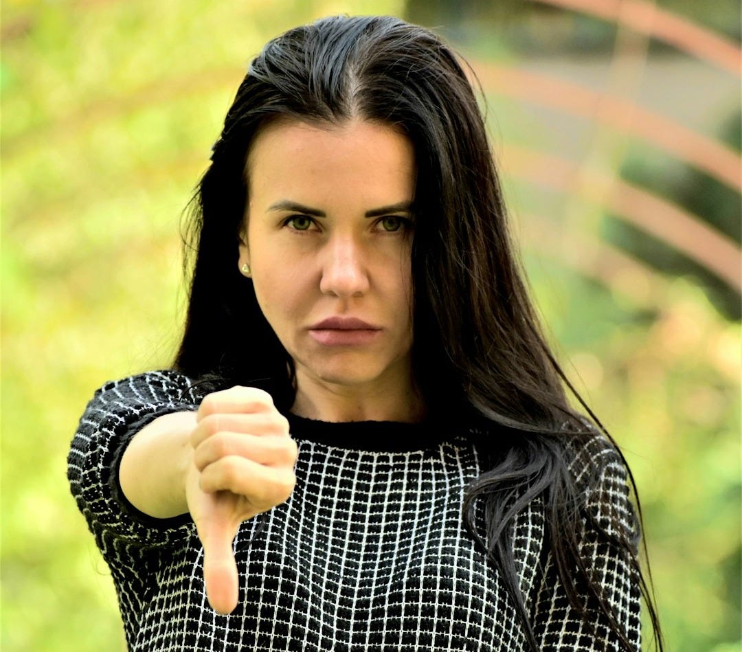 A woman pointing a gun at the camera A woman pointing a gun at the camera