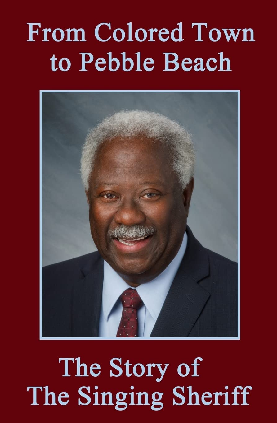 A book cover showing the photo of a smiling middle age black man. The title is From Colored Town to Pebble Beach