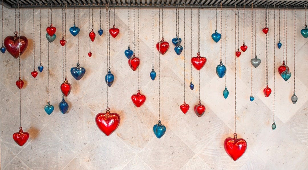 red and silver baubles on white textile