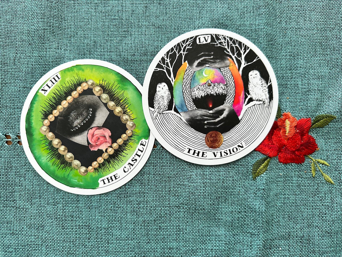 Two cards from the Wild Unknown Archetypes deck - the castle and the vision - placed on a greenish-blue woven table cloth, with a red rose embroidered on it. The cards are circular and designed as collages.