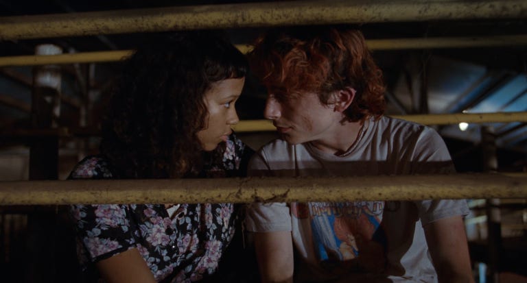 Taylor Russell as Maren (left) and Timothée Chalamet as Lee (right) in Bones and All (2022).