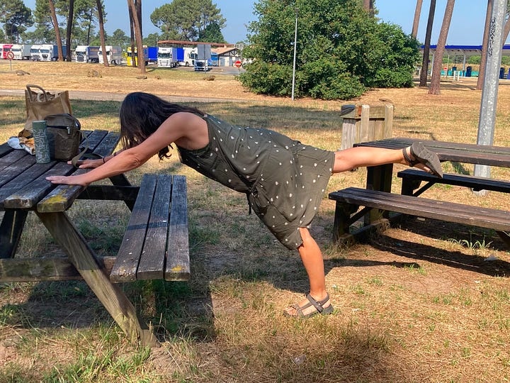 Spanish service station, and woman doing yoga in the picnic area