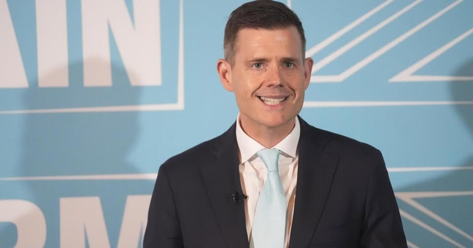 May be an image of one or more people and text that says 'IN'