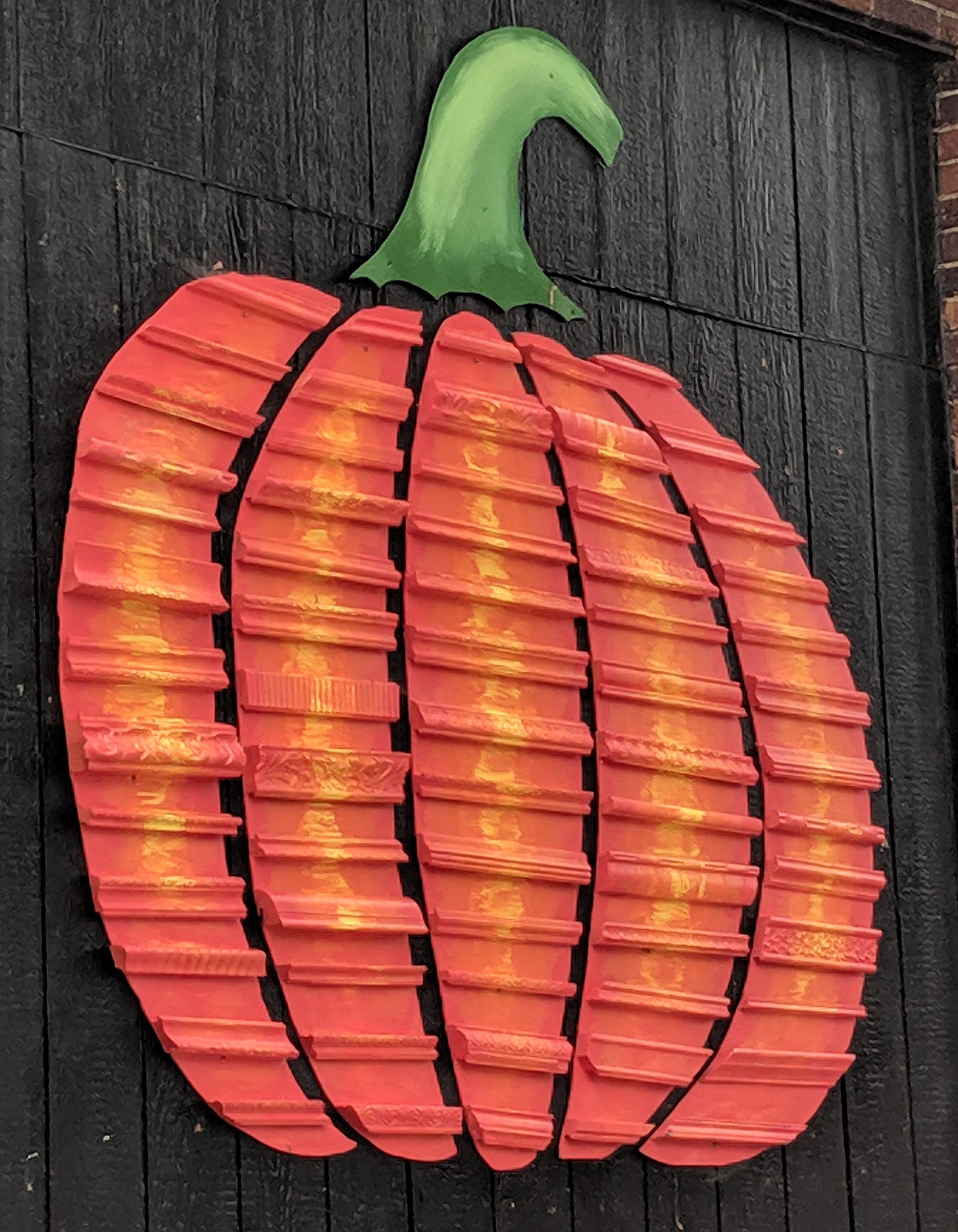 Photo of a pumpkin painted on the side of a building in Uptown Ankeny
