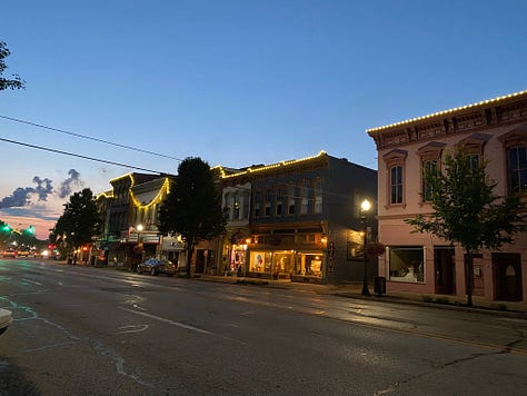 three pictures of Victorian buildings at twilight