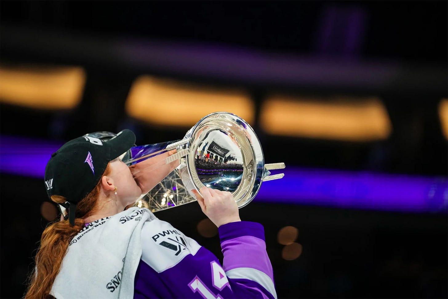 Dominique Petrie kissing the Walter Cup.