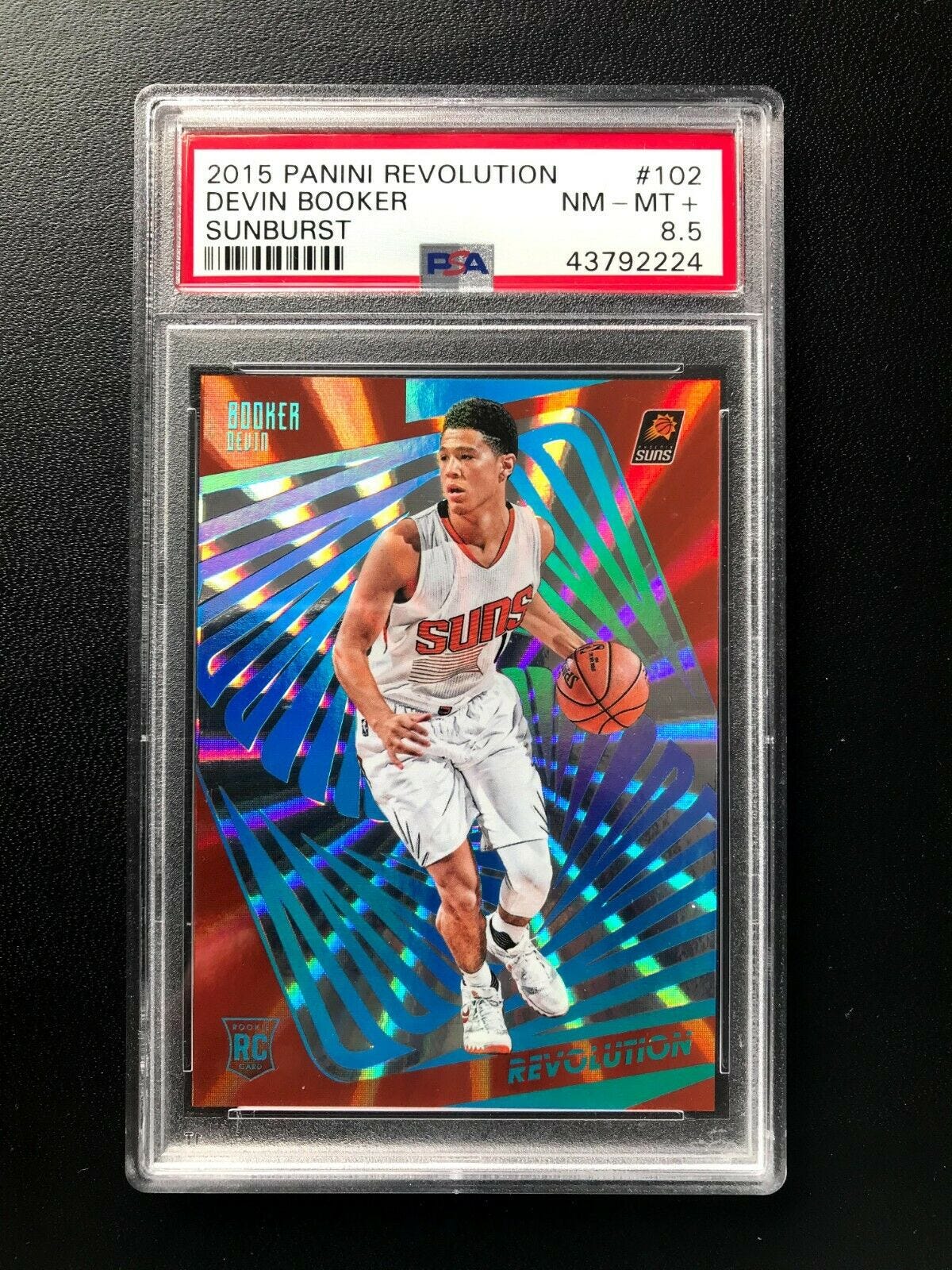 Image 1 - 2015-16 Panini Revolution * DEVIN BOOKER RC ROOKIE SUNBURST SP /75 * PSA 8.5