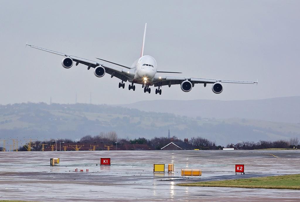Emirates Airline A380 makes a dramatic crosswind landing in Manchester — in  pictures