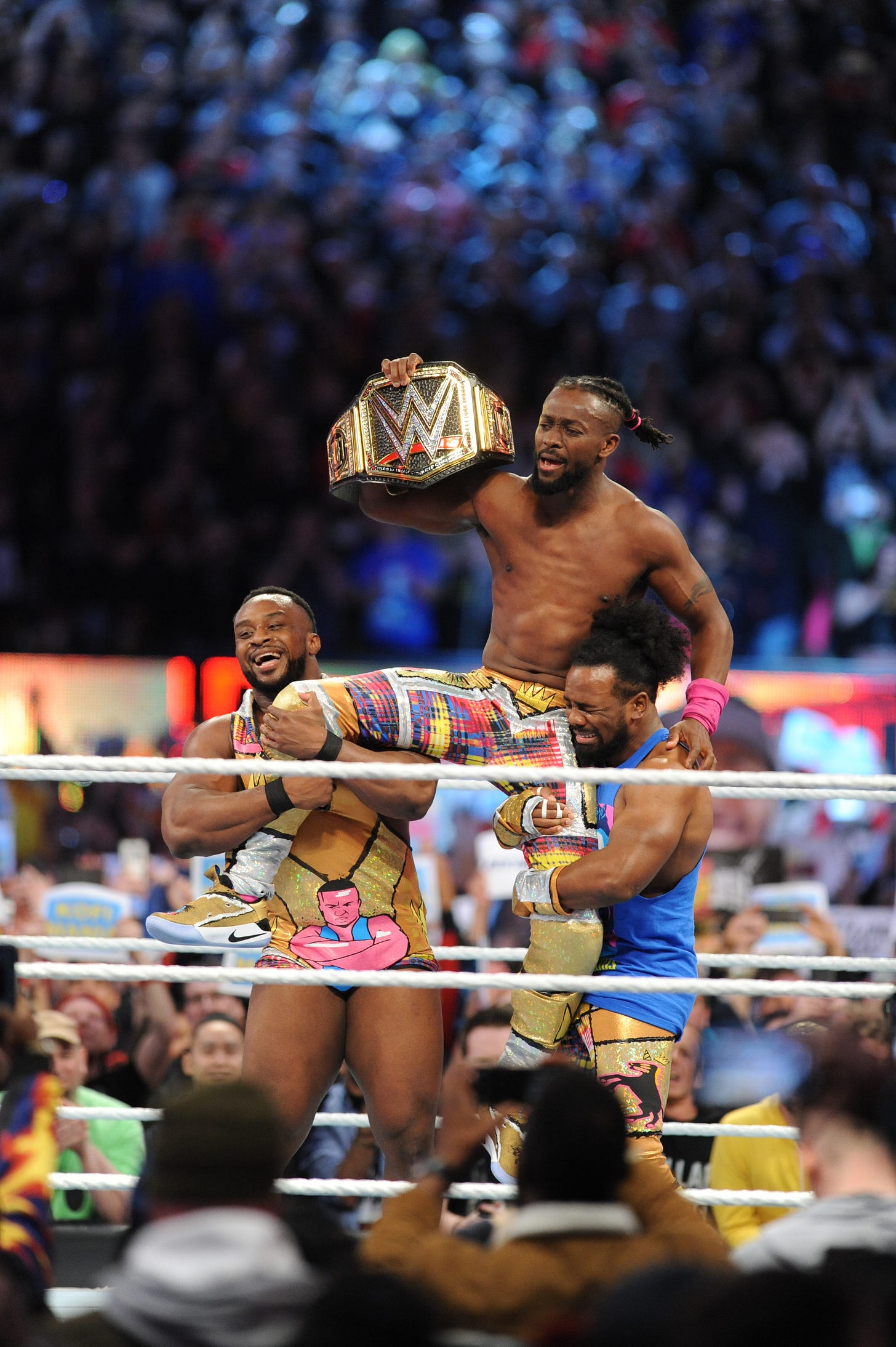 Kofi Kingston celebrates with his New Day partners, Big E and Xavier Woods, after winning the WWE World title at WrestleMania, April 2019