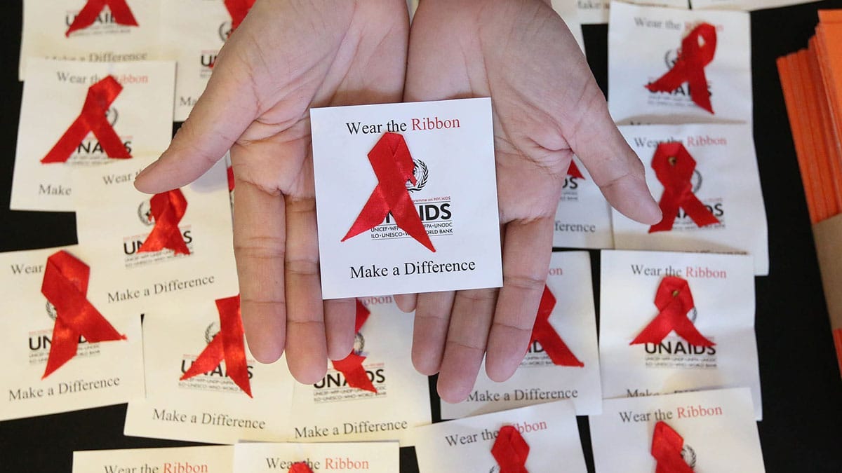 SYMBOL The red ribbon is a recognized symbol for HIV and AIDS awareness used in campaigns to support people living with the disease. This photo was taken during an AIDS awareness campaign in Taguig City in December 2018. —MARIANNE BERMUDEZ