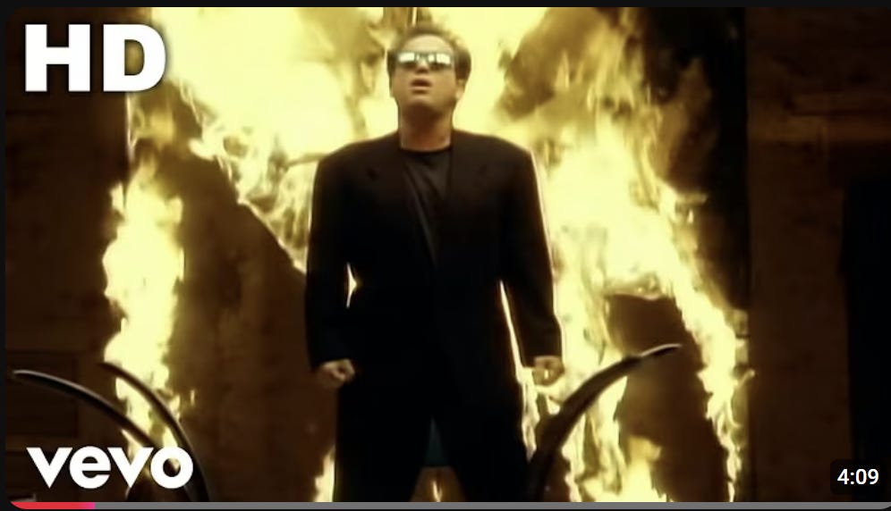 Screenshot from Billy Joel's "We Didn't Start the Fire" music video Screenshot from Billy Joel's "We Didn't Start the Fire" music video